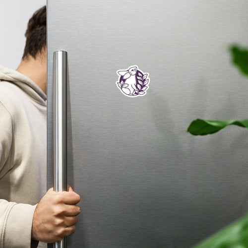 Bunny with leaves crest logo in a magnet form, mounted on a fridge.